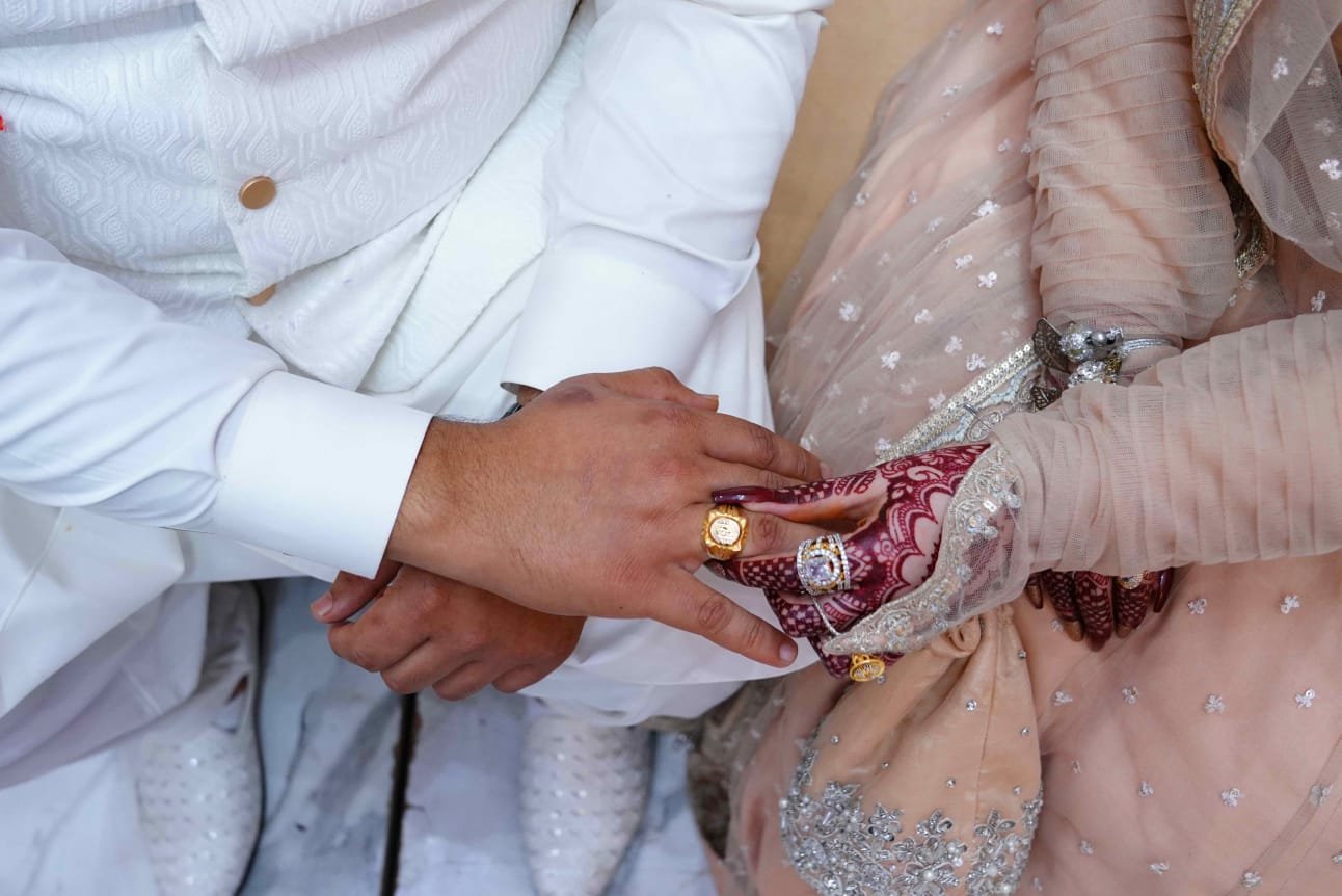 Holding Hands with Wedding Rings
